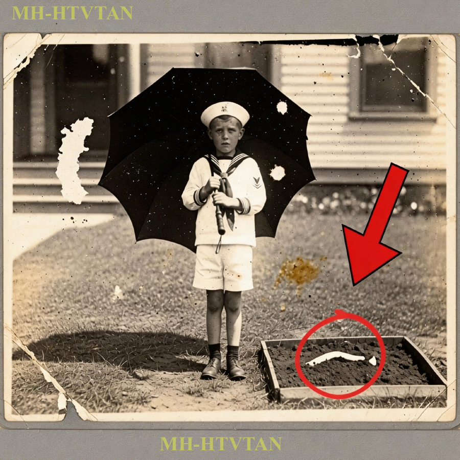 This 1910 Photo of a Boy Holding an Umbrella Looked Sweet—Until the Zoom Revealed Something Shocking